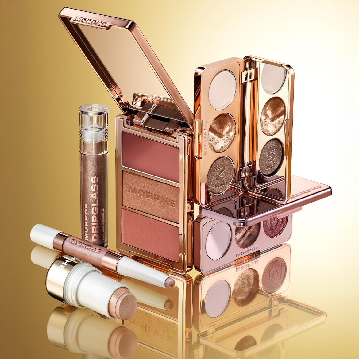 Gouden Morphe make-up set met oogschaduwpaletten, blush, highlighter en DripGlass lipgloss voor een complete look.