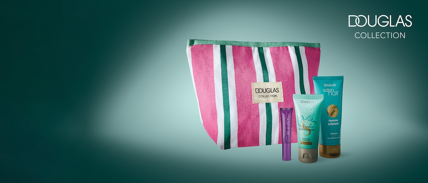 Roze gestreepte Douglas Collection make-up tas met een groene rand, samen met een paarse Lash It Up mascara en een blauwgroene Home Spa handcrème en Salon Hair shampoo.